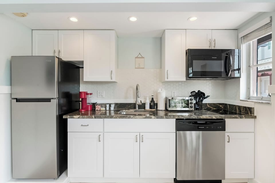 Cook, snack, or sip—this modern kitchen makes mealtime easy.
