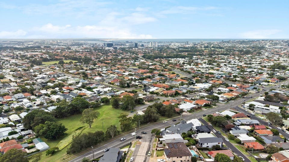Wide aerial view capturing the home’s central location