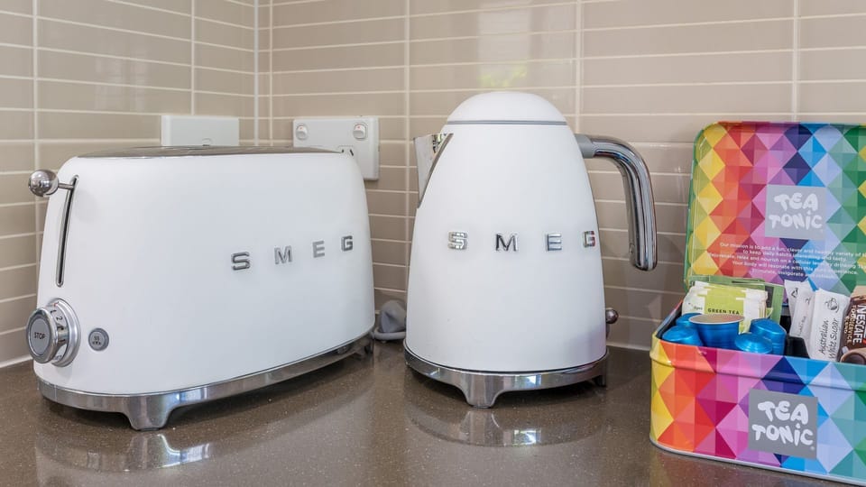 Kitchen appliances including SMEG toaster and kettle.