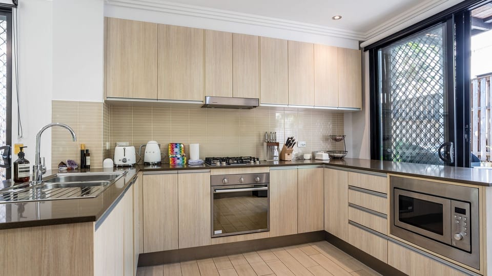Fully equipped kitchen with modern appliances and ample counter space.