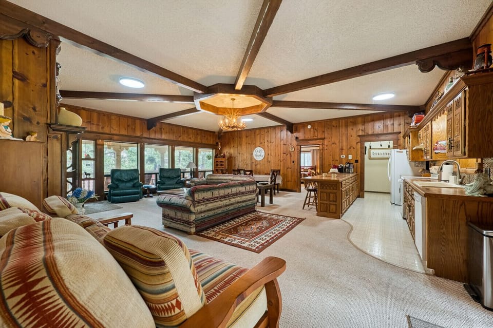 Living Room | Fireplace, Antler Chandelier & Rustic Cabin Décor