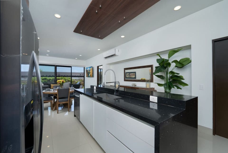 Spacious open-concept kitchen and living area.