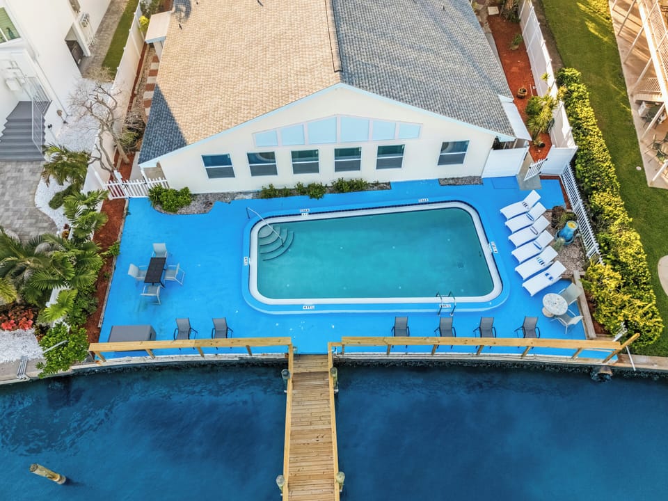 Relax by the pool, then step onto the dock for waterfront living.