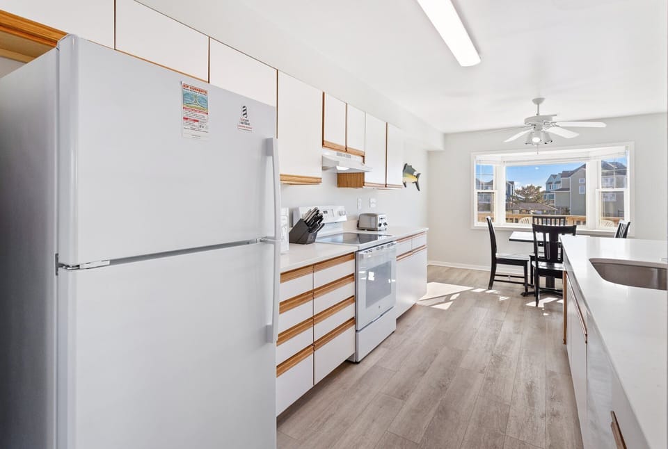 Kitchen — Well-appointed kitchen with full-size appliances, cookware, and ample counter space.