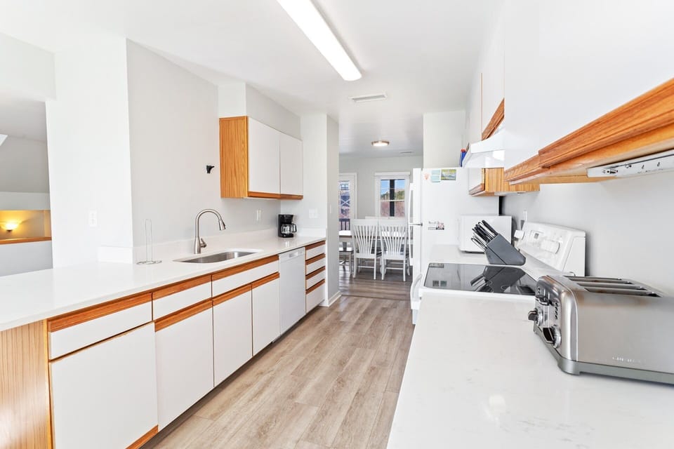 Kitchen — Well-appointed kitchen with full-size appliances, cookware, and ample counter space.