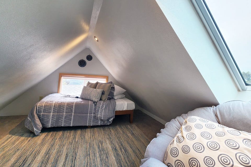 Loft space with a twin platform bed.