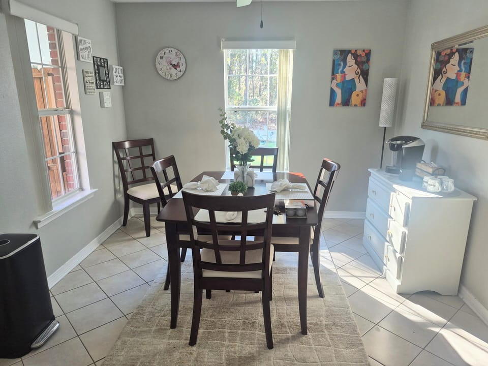 dining area, coffee and tea maker with coffee bar. 