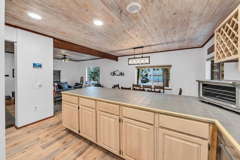 Kitchen: Main floor, drip coffee maker, French press, waffle maker, cooking utensils, tableware