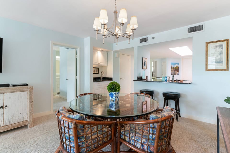 There's ample dining space for the whole family with 6 dining table seats (2 not shown) and two bar stools.