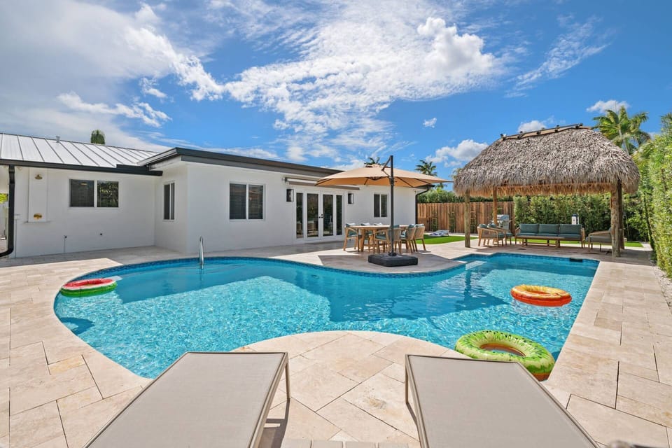 Sparkling private pool with expansive patio space designed for lounging, swimming, and enjoying the Florida sunshine.