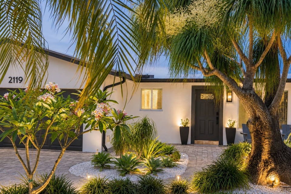 Welcome to Villa Palmera, a private tropical oasis blending modern style, lush landscaping, and effortless South Florida living