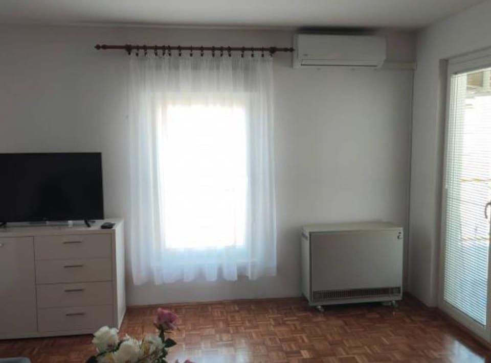 Apartment (One Bedroom Apartment with Balcony) | Living room | 32-inch flat-screen TV with digital channels