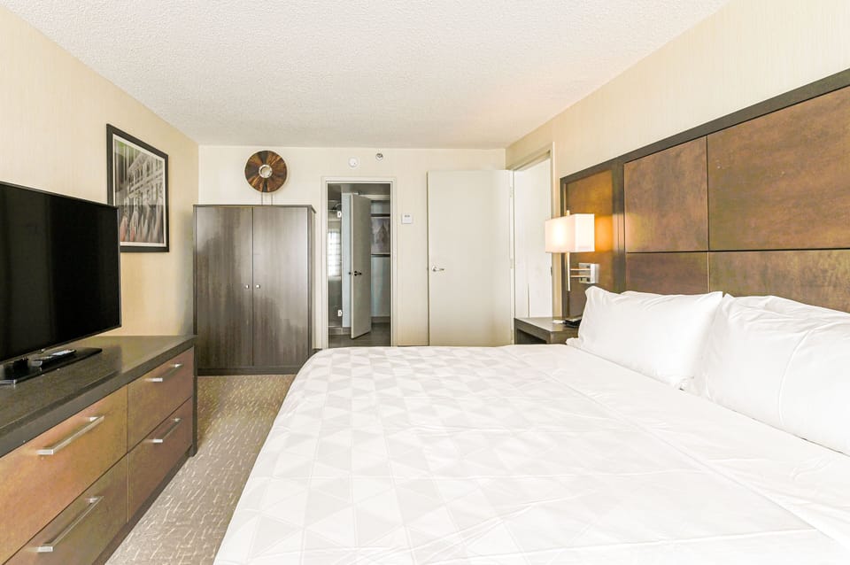 Premium bedding, desk, laptop workspace, iron/ironing board