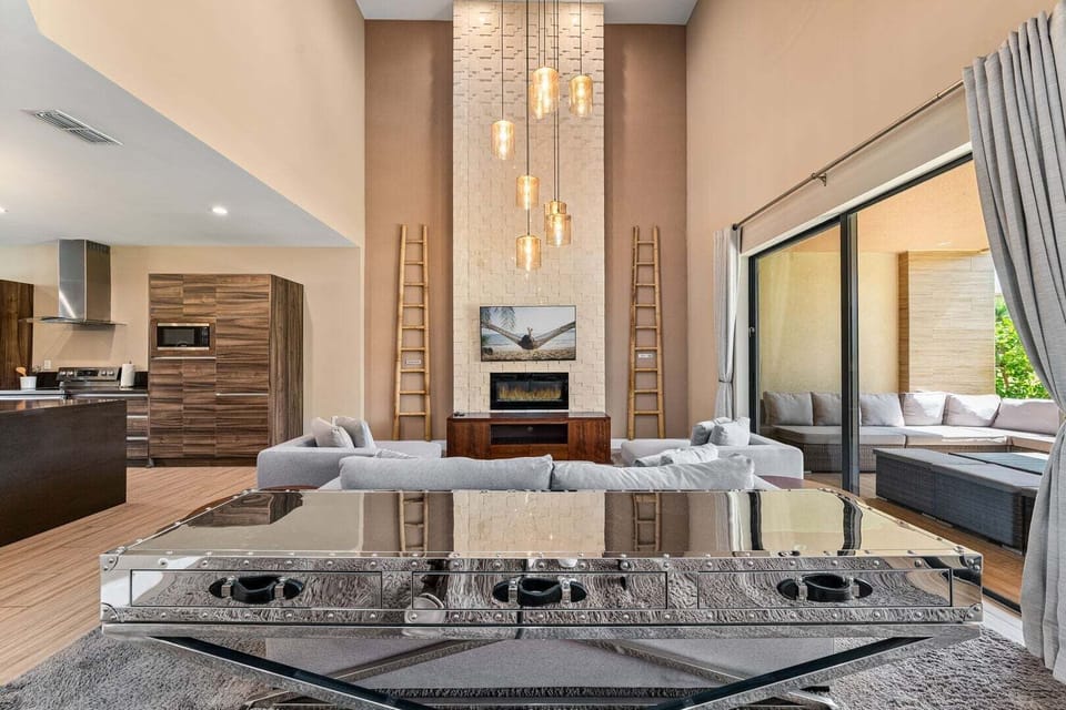 Unwind and enjoy cozy family time by the indoor fire pit, perfect for creating warm memories after a day at the parks.