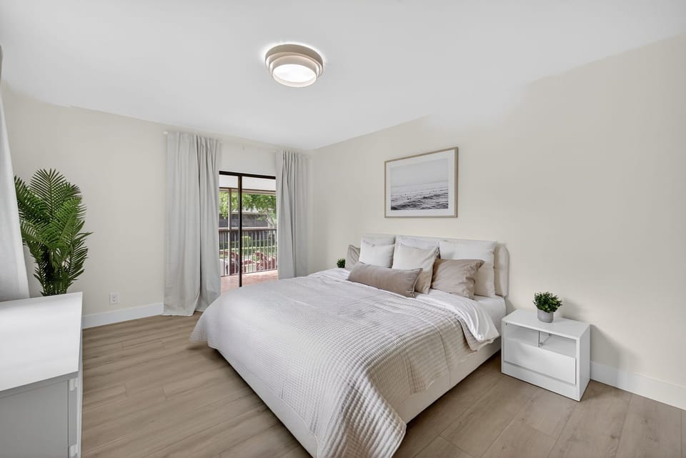 Master Bedroom With a King Bed and a Smart TV