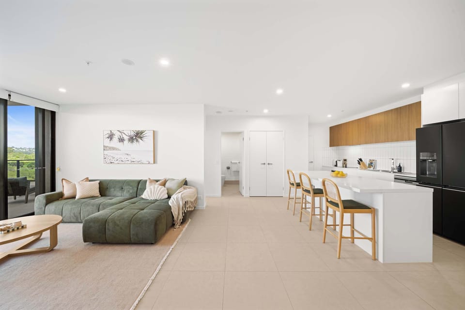 A light-filled open-plan living, dining, and kitchen space designed for easy flow, comfort, and relaxed everyday living.