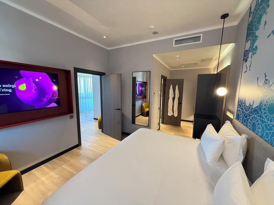 Luxury Suite, City View | In-room safe, blackout drapes, soundproofing, iron/ironing board