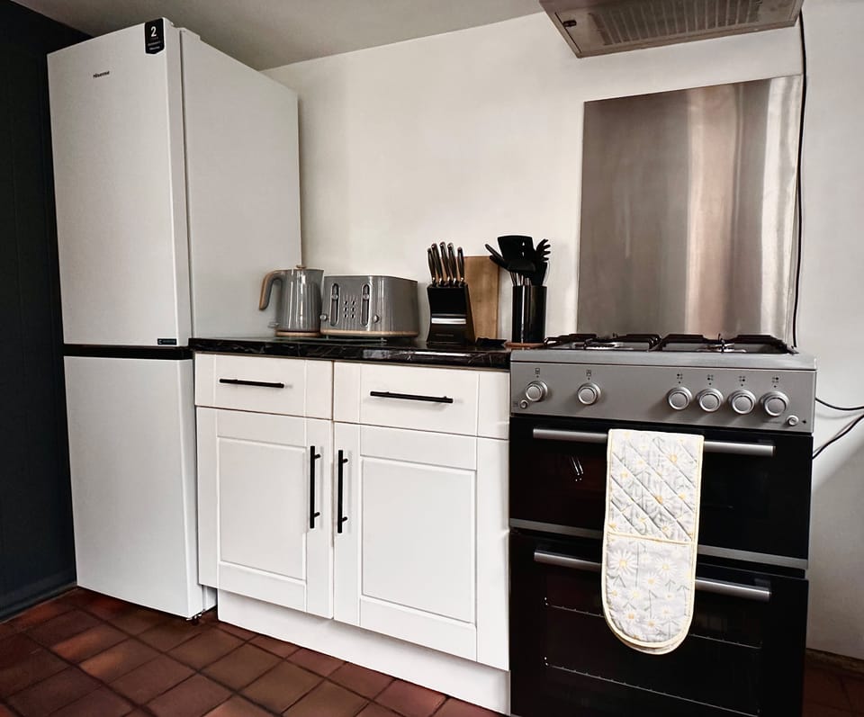 Apartment | Private kitchen | Full-size fridge, microwave, oven, stovetop