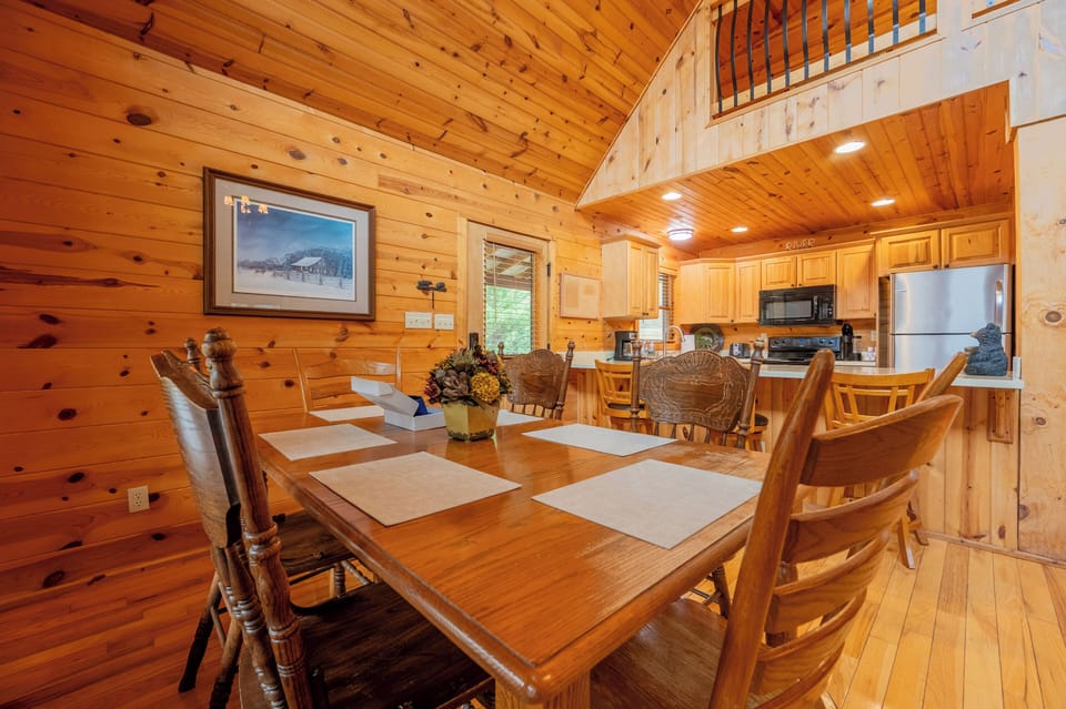 Rustic dining meets modern convenience in this cozy cabin kitchen.