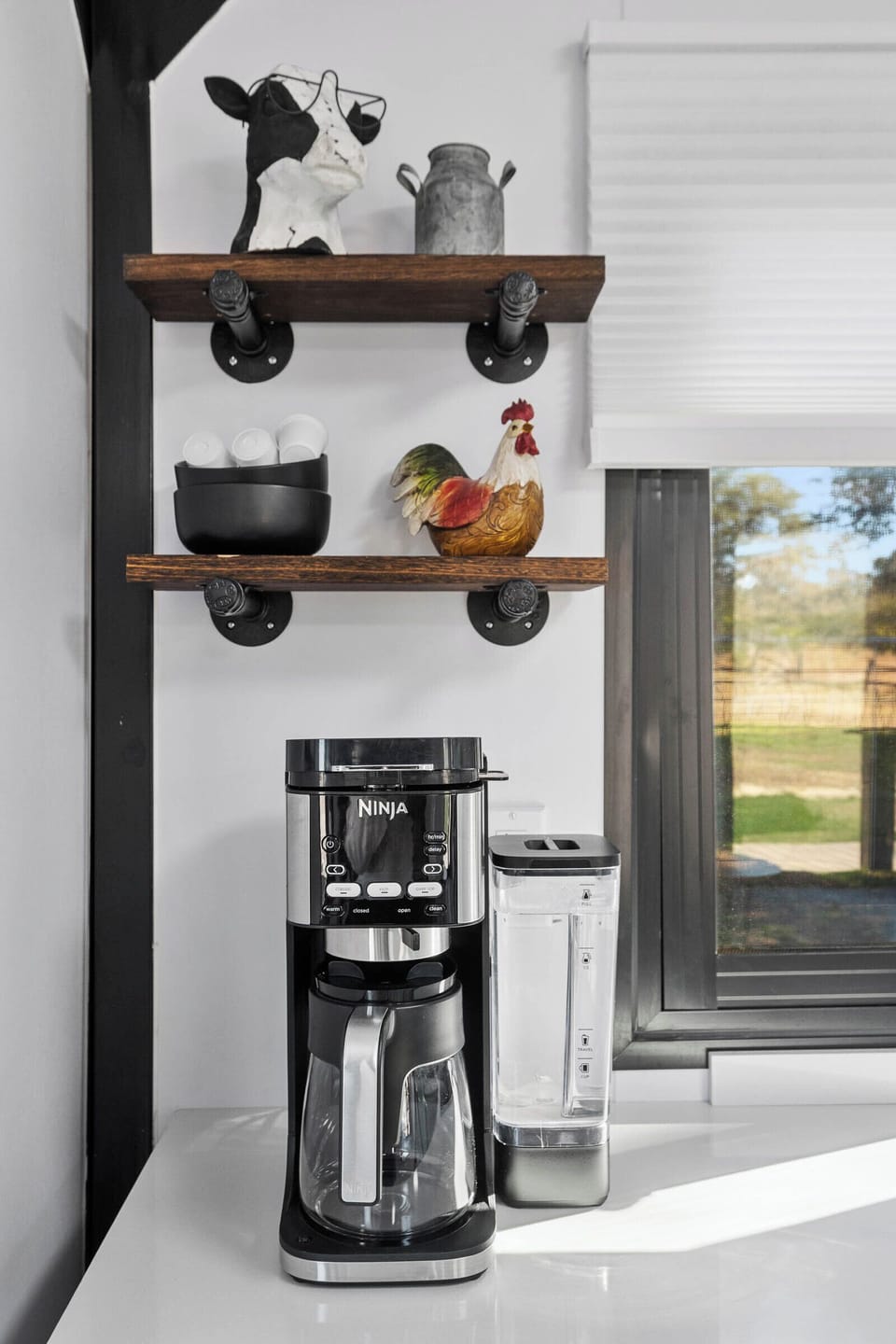 Start your day with fresh coffee from the stylish Ninja bar, surrounded by charming farm décor and peaceful Prescott views.