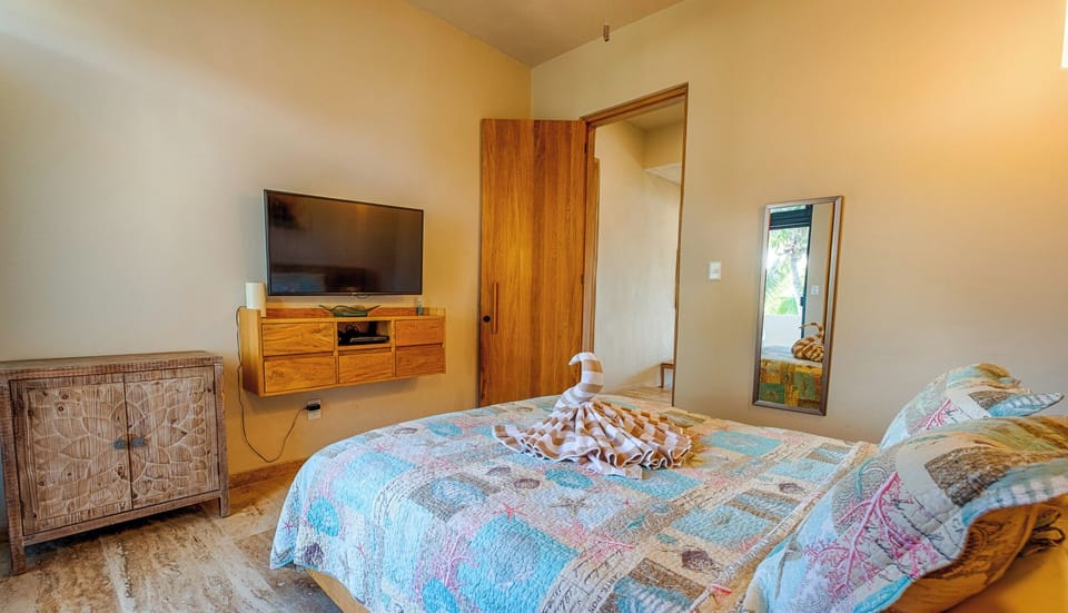 Bedroom Suite with a TV
