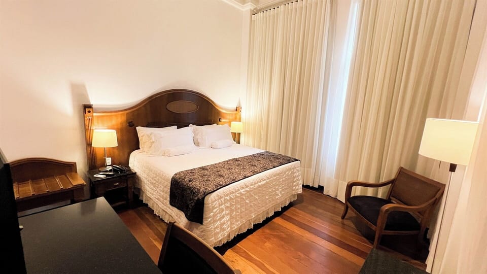 Settle into plush bedding under warm, calming lamplight.