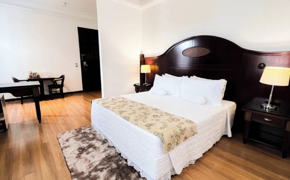 Unwind on crisp linens in a calm, spacious bedroom