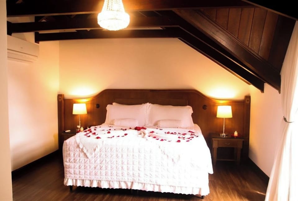 Drift off on crisp linens in a cozy, romantic setting.