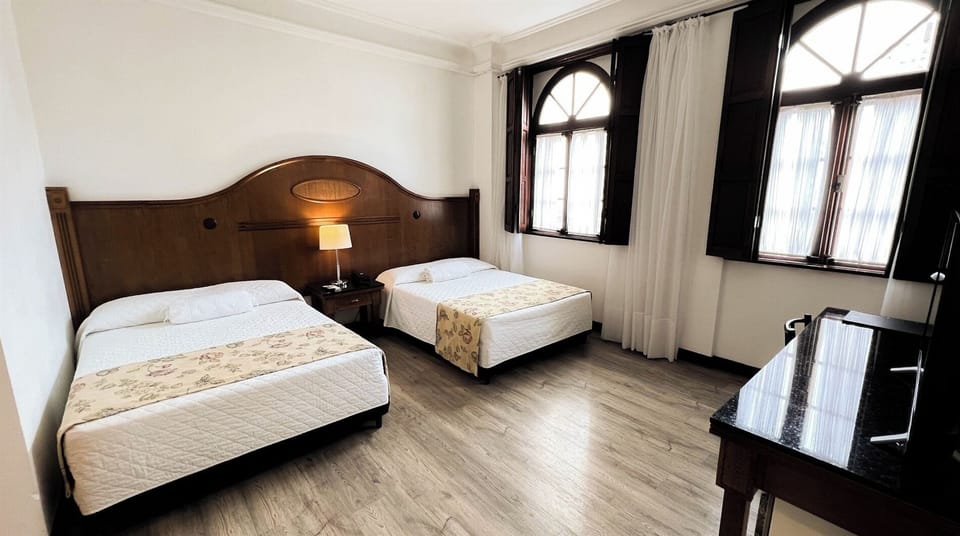 Relax by charming arched windows after a day exploring.