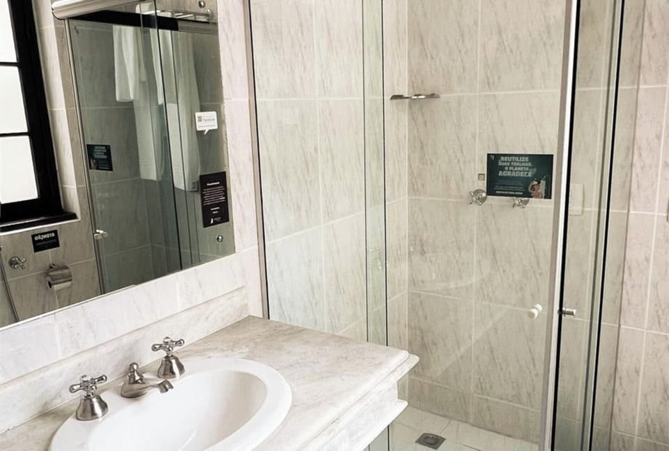 Step into a sleek glass shower for an easy reset.