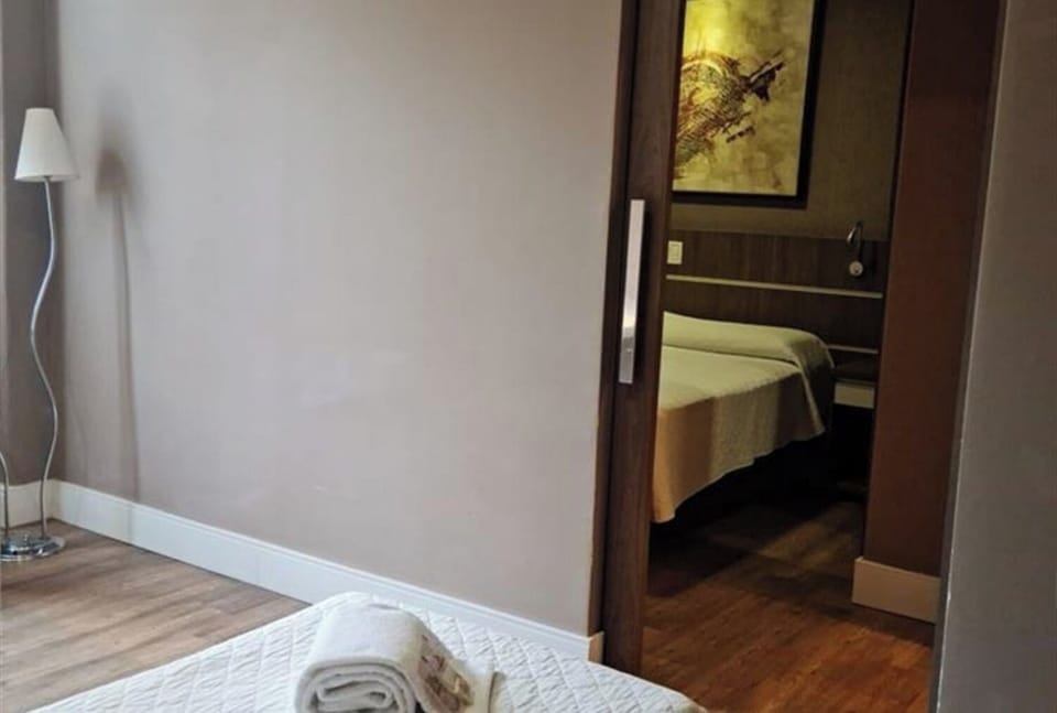 Sink into a neatly made bed with fresh linens and towels.