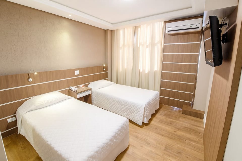 Unwind in bright twin beds with crisp linens and AC.