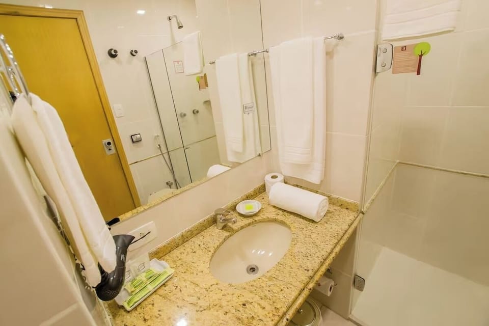 Refresh at the granite vanity with fluffy towels ready.