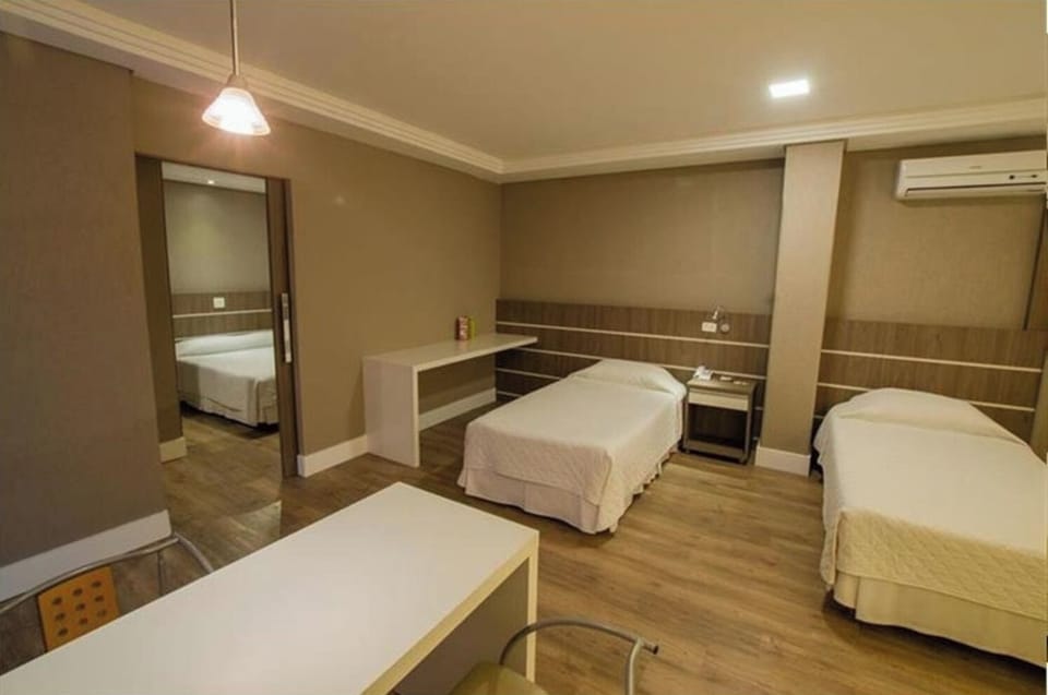 Spread out comfortably with twin beds, AC, and spacious floors.