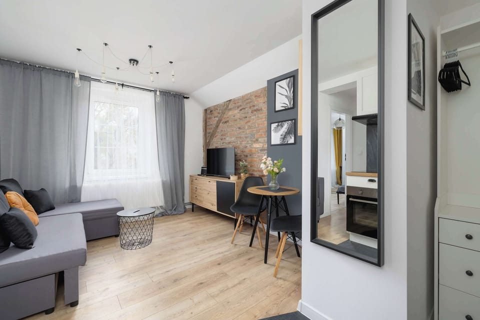 A full-height mirror and subtle lighting visually enlarge the interior, adding a light and modern feel.
