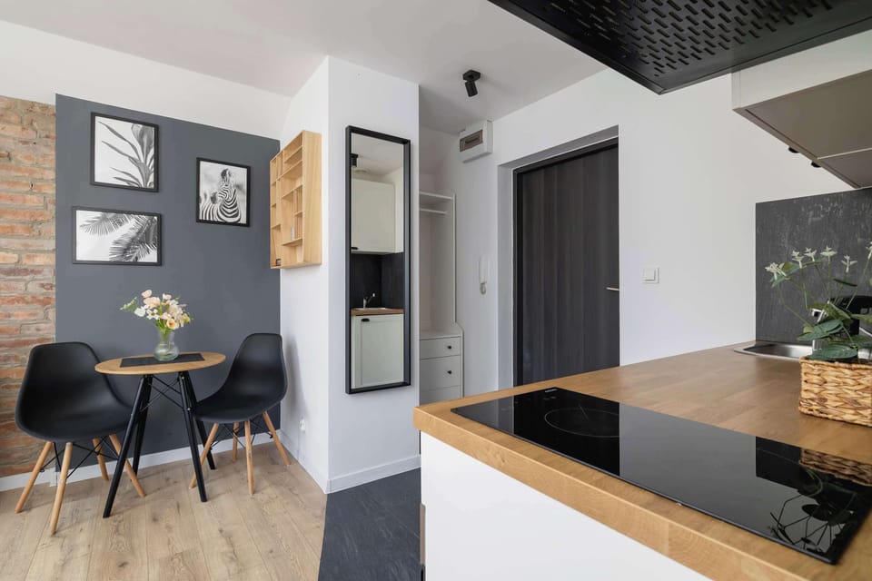 The brick wall and black accents add character to the interior, creating a stylish backdrop for shared meals and conversations.
