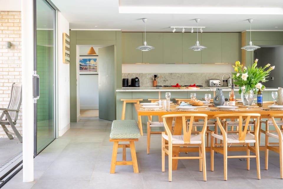 Ground floor: Dining area with access to rear terrace and snug