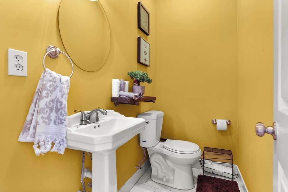 Compact half bathroom with modern fixtures—ideal for quick and easy access.