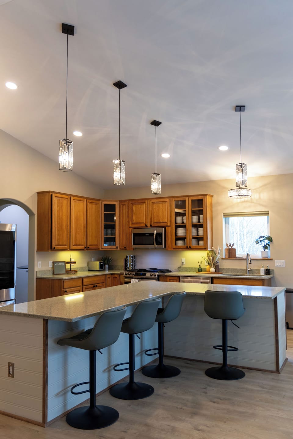 Kitchen offers vaulted ceilings, and large island with seating for four
