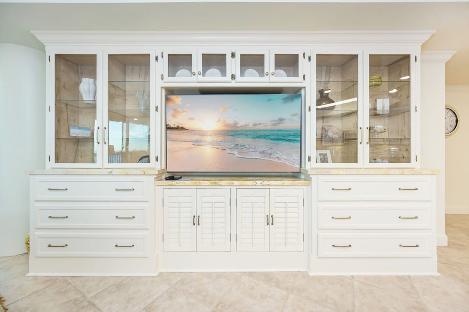 Unwind in this inviting family room with cozy seating and enjoy a movie or stream your favorite shows