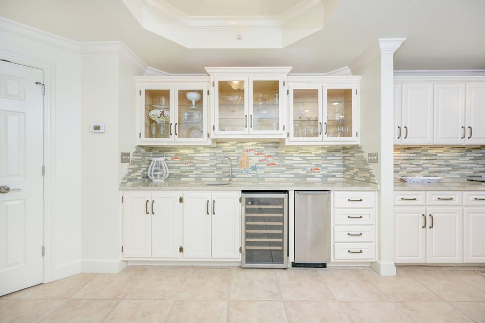 Grab a chilled bottle from the wine cooler or create your favorite cocktail at the wet bar