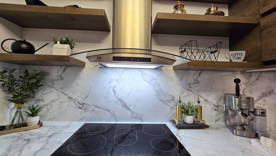 Flat top cooking range for easy clean ups