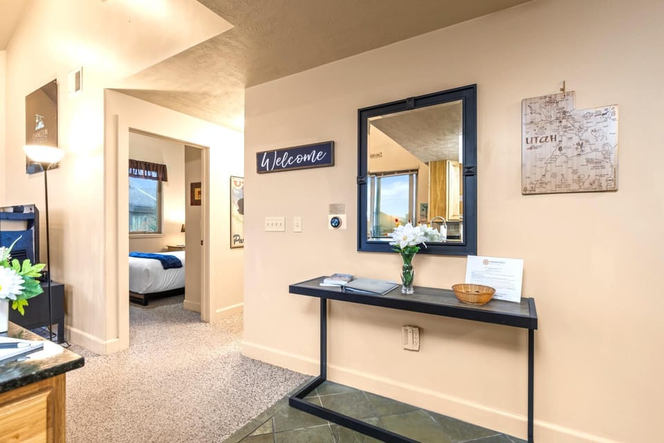 Entryway features a bench and mirror for easy arrivals, departures, and mountain gear.