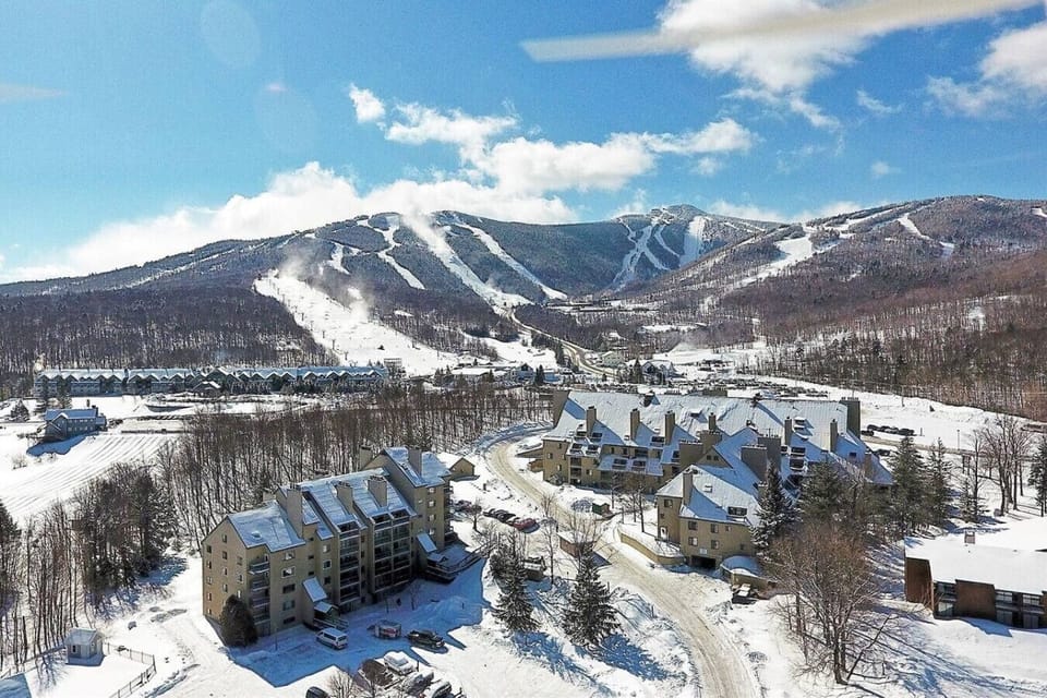 Stunning aerial view of Killington Mountains covered in winter snow.