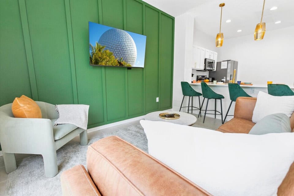 Relax after a fun day at the parks in our cozy living area with comfy seating and a flat-screen TV.