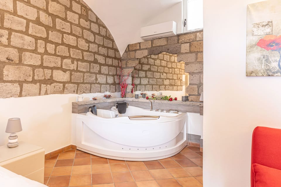 Junior Suite, Jetted Tub | Minibar, in-room safe, desk, soundproofing