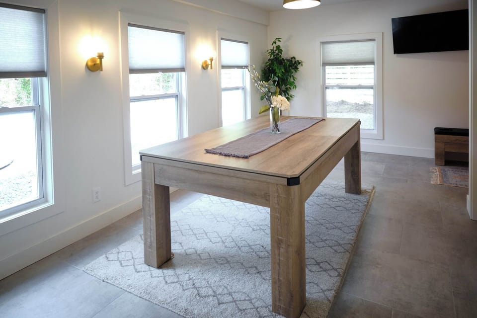 Dining table in game room with benches seats 6
