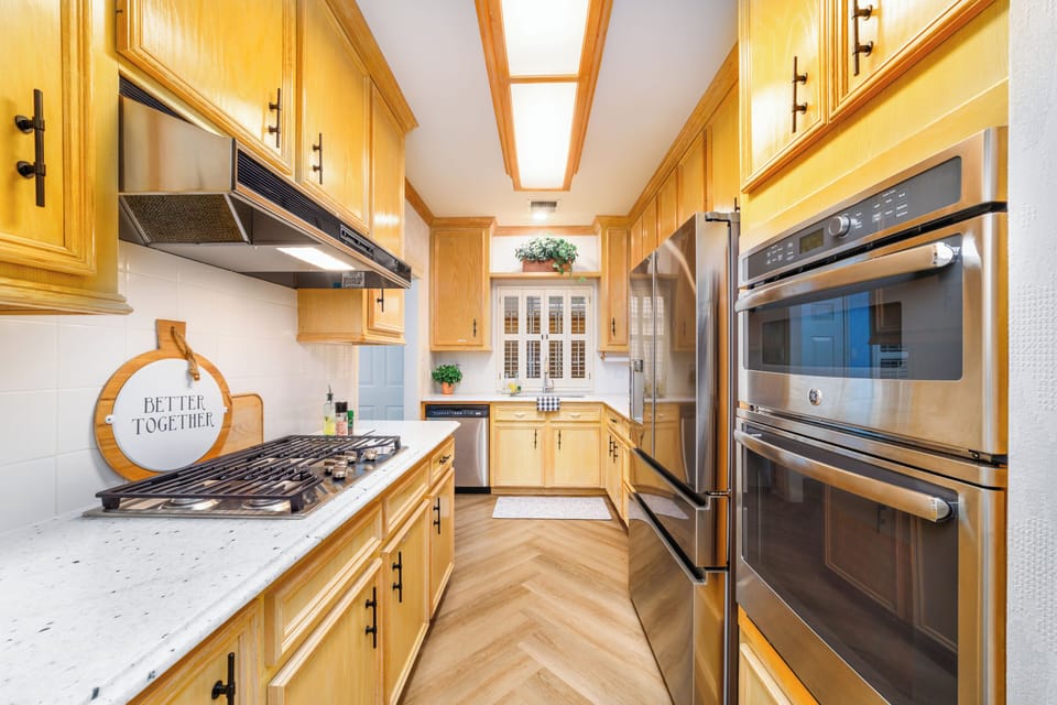 Full kitchen with built-in microwave and oven