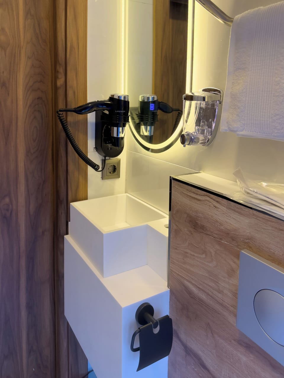 Shower, hair dryer, slippers, towels