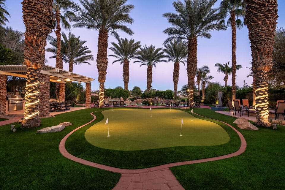 Backyard: pool & spa, large putting green, sun lounge chairs, natural gas fire-pit, outdoor kitchen area